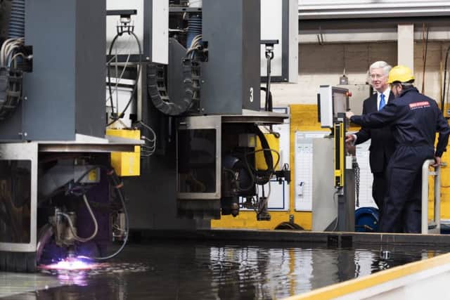Former defence secretary Sir Michael Fallon  started the computer-guided laser tocut the first first piece of steel for HMS Glasgow, the first of three new frigates at Govan shipyard in Scotland last September