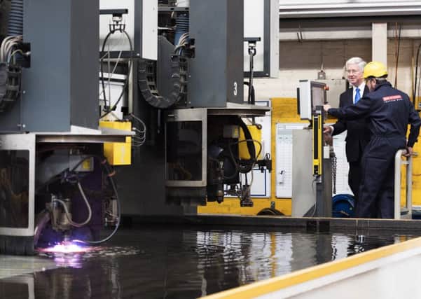 Former defence secretary Sir Michael Fallon  started the computer-guided laser to
cut the first first piece of steel for HMS Glasgow, the first of three new frigates at Govan shipyard in Scotland last September