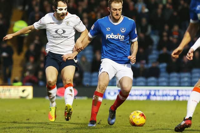 Matt Clarke takes on Danny Hylton in Pompey's January 2017 victory at Luton. Picture: Joe Pepler