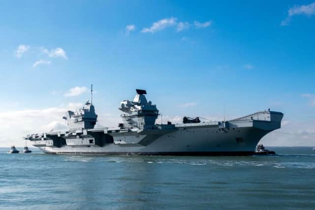 The HMS Queen Elizabeth returns to Portsmouth Harbour after sea trials. Picture: Steve Parsons/PA Wire