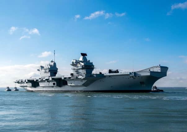 The HMS Queen Elizabeth returns to Portsmouth Harbour after sea trials. Picture: Steve Parsons/PA Wire