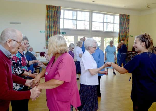 Care home residents and their carers strut their stuff on the dance floor at the Dementia Tea Dance at St Faith's Church Parish Centre in Lee-on-the-Solent   Picture by David George