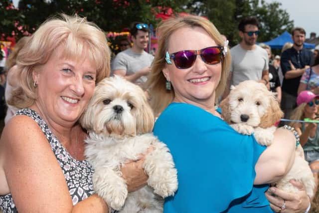 The First Funtley Village Fete for 40 years raising money for a defibrillator for the village.  The Dogs that look like their owners competition. Julie Patterson with Toby (Fareham) and Sue Rogers with Lulu (Funtley).  Picture: Keith Woodland