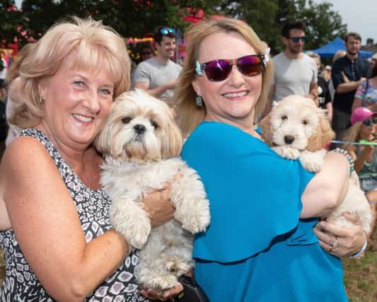 The First Funtley Village Fete for 40 years raising money for a defibrillator for the village.  The Dogs that look like their owners competition. Julie Patterson with Toby (Fareham) and Sue Rogers with Lulu (Funtley).  Picture: Keith Woodland