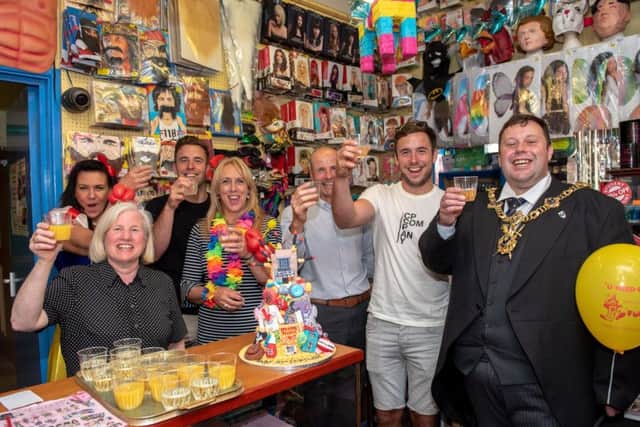U-Need-Us 95th Anniversary - Lord Mayor Cllr Lee Mason and the owners and staff of the shop raise their glasses to celebrate  Picture: Vernon Nash (180396-006)
