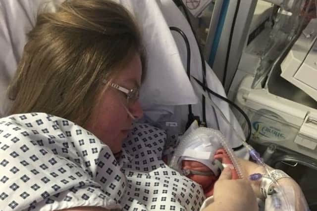 Lynette Kirkham, 31, from Gosport, with her son Elijah after giving birth.