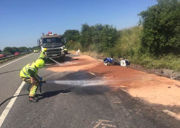 Teams working to clean the road earlier today. Picture: Hants Roads Policing on Twitter