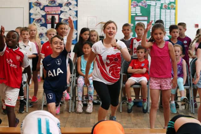 Performing the exercise routine, front, left to right, Oluwatobi Babatolu, George Brown, Katrina Hart, Laura Davis and Grace Westmuckett. Those behind are waiting to exercise. Picture: Chris Moorhouse