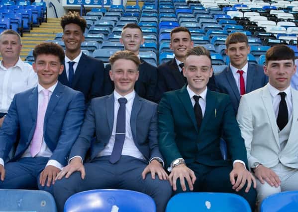 Eight new Pompey scholars pen two-year deals at Fratton Park.  Back row: Academy chief Mark Kelly, Haji Mnoga, Alfie Stanley, Harry Kavanagh, Stan Bridgman and coach Liam Daish. Front row: Tom Bruce, Ethan Robb, Liam Kelly and Leon Pitman. Picture: Simon Hill/Portsmouth FC