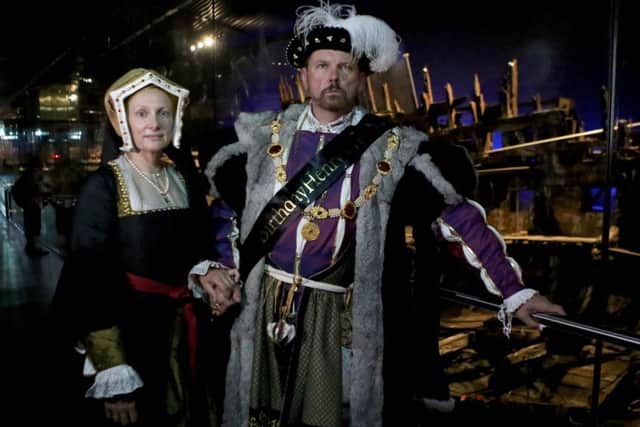 Molly Housego and Ian Pycroft dressed as King Henry VIII in front of the Mary Rose.Picture: Habibur Rahman