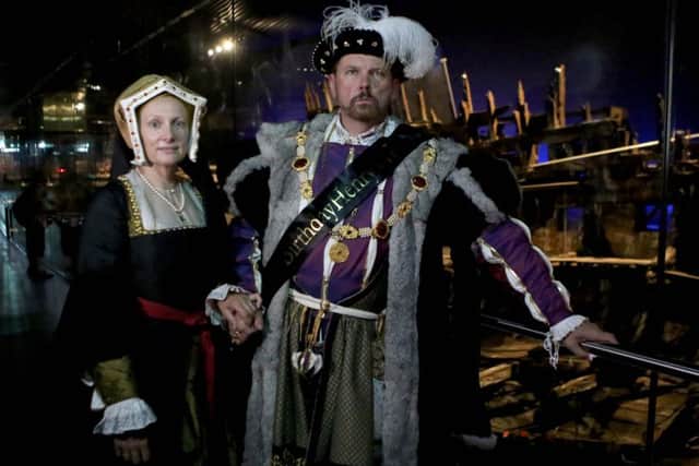 Molly Housego and Ian Pycroft dressed as King Henry VIII in front of the Mary Rose.

Picture: Habibur Rahman
