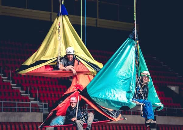 Travel writer and author Phoebe Smith, rigging specialist Ollie Laker and rope specialist and A&E doctor John Pike suspended at the Stadium of Light. Picture: Zak Bentley