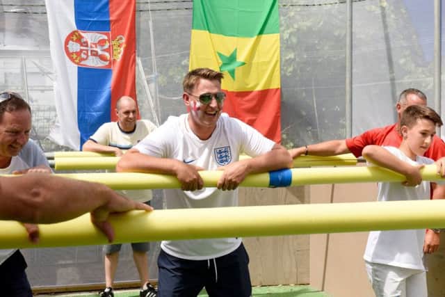 People playing on the life sized table football pitch Picture: Tom Harrison/Solent News & Photo Agency