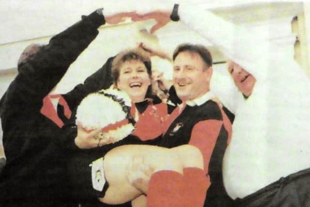 Sherry Davies and Keith Tolson leave the ceremony