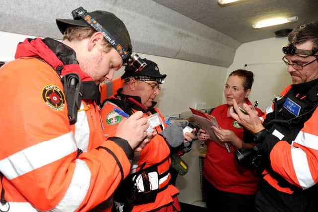 Nathan Allen, search technician, Terry Huppler, team leader, Michelle Bavin, training officer and Stephen Bavin, team leader, during a briefing.
Picture: Sarah Standing