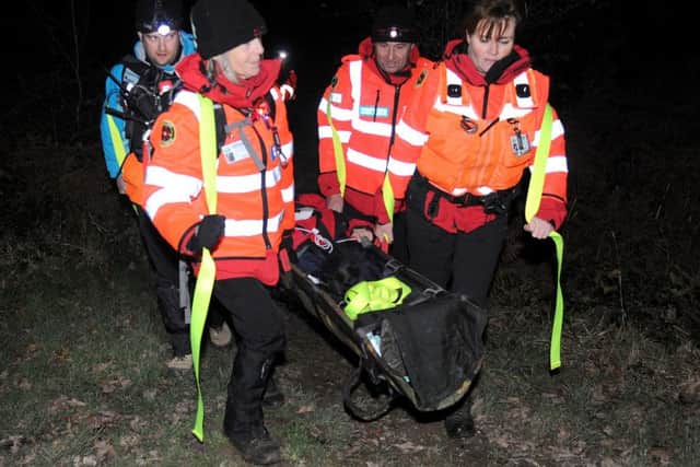 Left to right, trainee searcher Cai Ruddick-Smith, search technician Julie Bennett, search technician and medical training officer Gordon and team leader Susan Hayward carrying Nicki Murray on a stretcher during the training search.
Picture: Sarah Standing