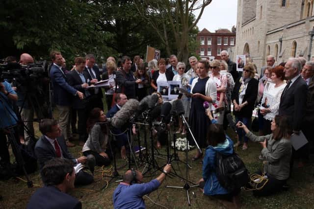 Bridget Reeves, whose grandmother Elsie Devine died at Gosport War Memorial Hospita, reads a statement to the press on behalf of the families on June 20 outside. Picture: Chris Moorhouse