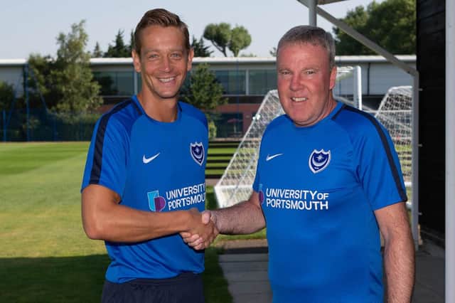 New Pompey coach Paul Robinson is welcomed back by Kenny Jackett. Picture: Simon Hill