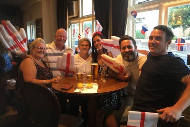 Fans watch England against Belgium in the Red Lion pub in Cosham