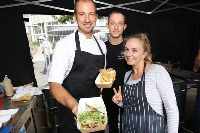 Gary and Hayley Morton-Jones and Ian Clarke preparing fish and chips at 2017's Portsmouth Seafood Festival