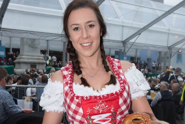 The world famous Oktoberfest returns to Portsmouth for a huge weekend of traditional Bavarian entertainment, food and drink.  Jessica Danter with traditional pastries.  Picture Credit: Keith Woodland