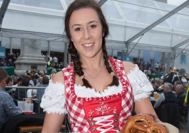 The world famous Oktoberfest returns to Portsmouth for a huge weekend of traditional Bavarian entertainment, food and drink.  Jessica Danter with traditional pastries.  Picture Credit: Keith Woodland
