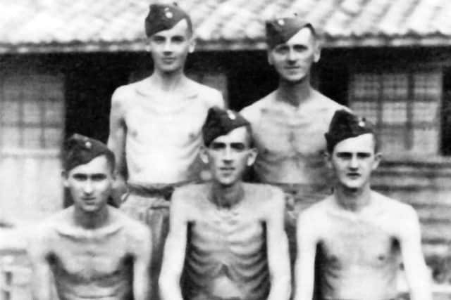 Five emaciated British soldiers after being liberated from a Japanese prisoner of war camp.