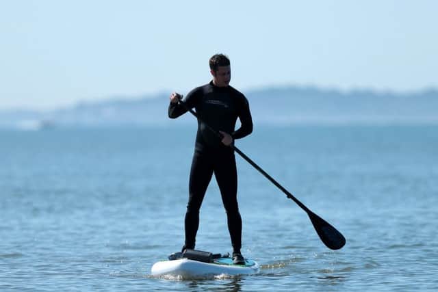 Richard Torkington enjoying the hot weather on Sunday at Stokes Bay, Gosport Picture: Chris Moorhouse PPP-180306-162637006