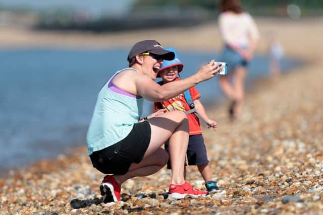 Nicola Pendleton and her son, Jacob, one, enjoying the hot weather on Sunday at Stokes Bay, Gosport                          Picture: Chris Moorhouse      PPP-180306-162648006