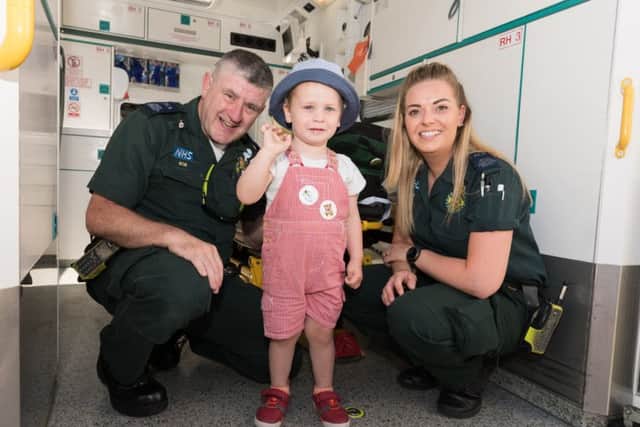 Emergency care assistants Bob Bell (Left) and Georgia Preston (right) of South Central Ambulance Service with Oliver Zaatar (2Yrs)
Picture: Duncan Shepherd