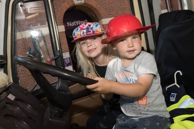Cora, 4, and Loe, 2, Barker at the wheel of a Hampshire Fire and Rescue fire tender
Picture: Duncan Shepherd
