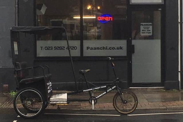The rickshaw outside Paanchi takeaway on Fratton Road on the day it was opened. The passenger cart is usually parked in a bay outside the shop.