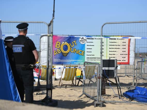 The scene on Gorleston beach in Norfolk, after a young girl died after being thrown from a bouncy castle. Picture: Joe Giddens/PA Wire