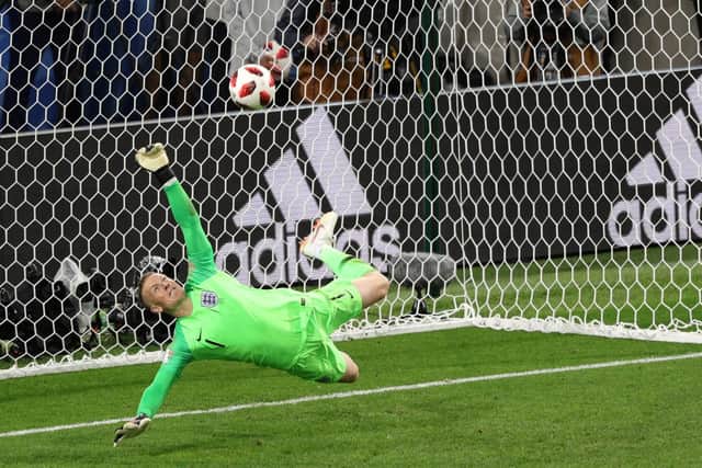 England goalkeeper Jordan Pickford saves a penalty from Colombia's Carlos Bacca last night Picture: PA Wire