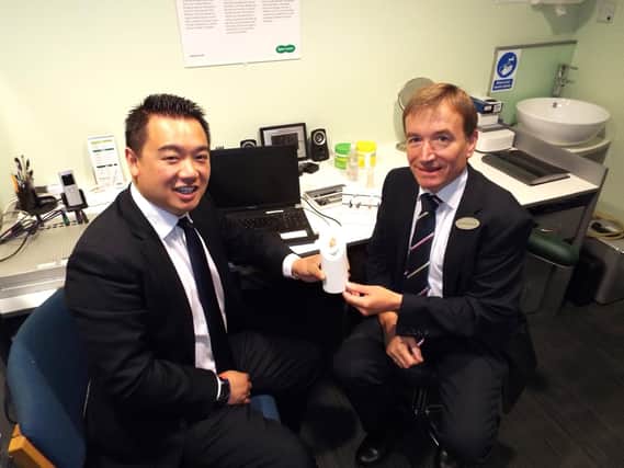 Alan Mak MP with Specsavers Havant audiology director Clive Harrod