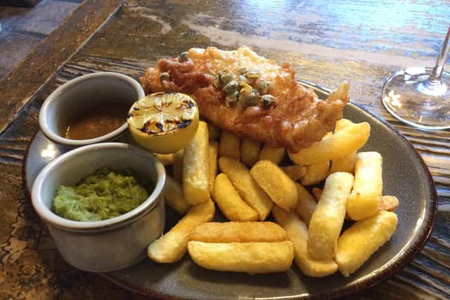 Fish and chips garnered with cockles
