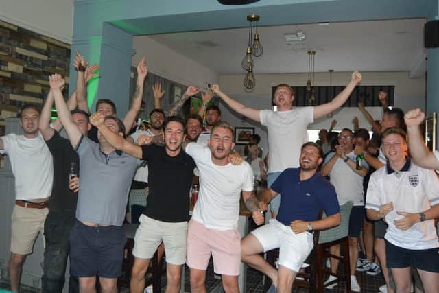 Fans celebrating at The Portsbridge after England's win against Colombia in the World Cup