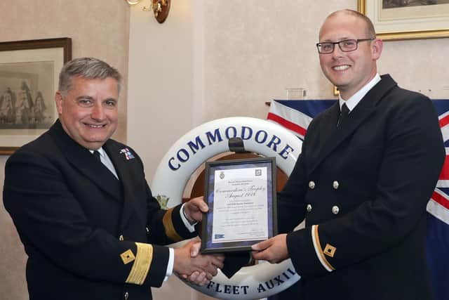 3/0(LS) Jamie Sampson receiving the Commodores Trophy from Commodore Duncan Lamb