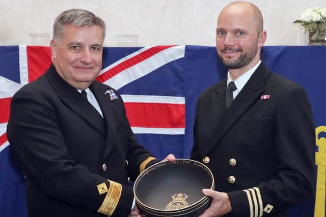 Pictured is C/O(X) Jamie Finlay receiving the Wedgwood Bowl on behalf of RFA Mounts Bay from Commodore Duncan Lamb