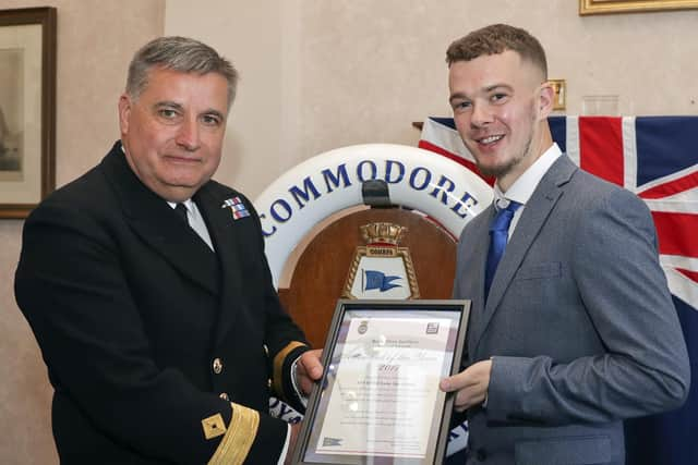 Apprentice Steward Luke Speakman receiving the RFA Steward of the Year award from Commodore Duncan Lamb