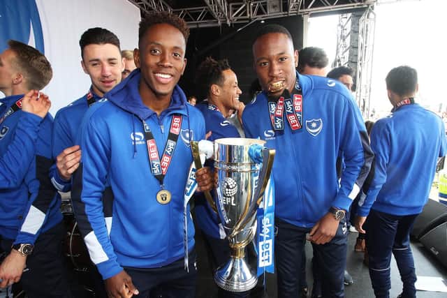 Jamal Lowe, left, and Nicke Kabamba with the League Two title. Picture: Joe Pepler
