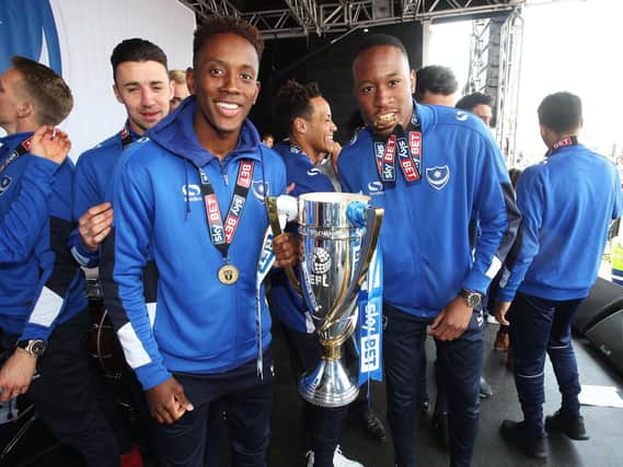Jamal Lowe, left, and Nicke Kabamba with the League Two title. Picture: Joe Pepler