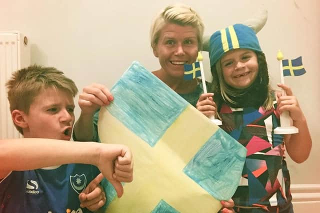 Jennie Weston, middle, with daughter Tova, right (supporting Sweden) and her son Kasper (who will be backing the Three Lions)