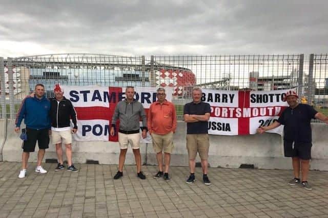 Barry Shotton and Phil Templeman with other Pompey fans in Russia. Picture: Supplied
