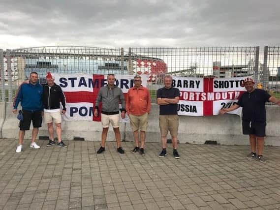 Barry Shotton and Phil Templeman with other Pompey fans in Russia. Picture: Supplied
