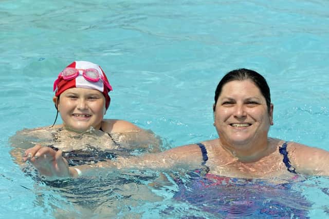 The new improved Hilsea Lido. Lyn Tier from Gosport and daughter Jasmine Tier (10) enjoy the warm water at the Lido.