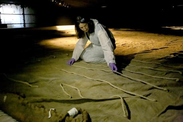 Senior conservator Diana McCormack with the unfurled Trafalgar Sail Picture: Habibur Rahman