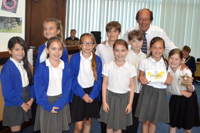 St John's C of E Primary School students with Fred Dinenage and their gold award for Best Container Garden