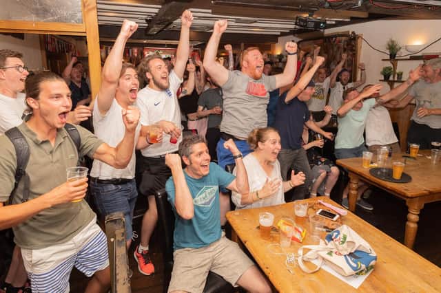 Cheers erupt in the Fat Fox pub in Southsea after England score their second goal, to claim victory against Sweden and a place in the World Cup semi-finals. Picture: Keith Woodland