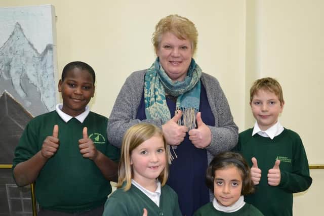 Headteacher Roberta Kirby with pupils from Fernhurst Junior School